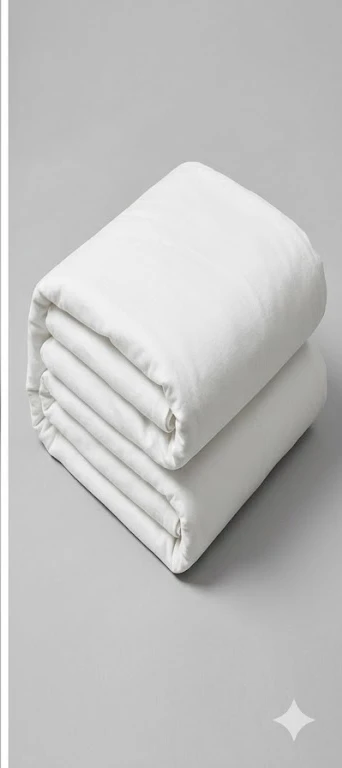 Crisp white hotel bed linen and pillowcases for hospitality use